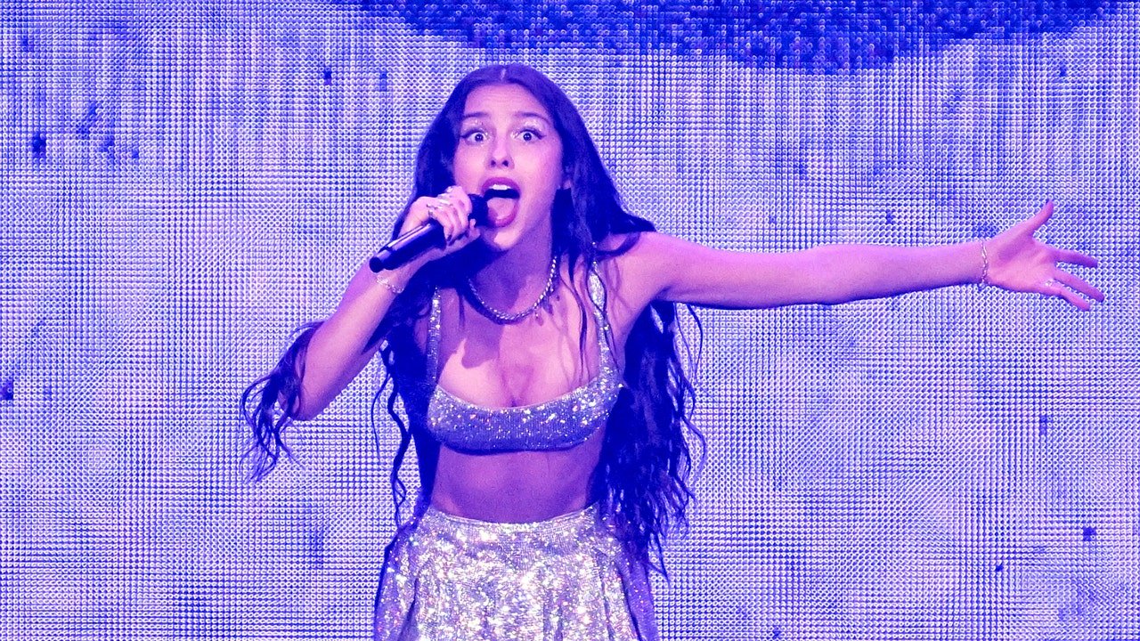 Olivia Rodrigo falls through a stage trap door during the "Guts" tour.