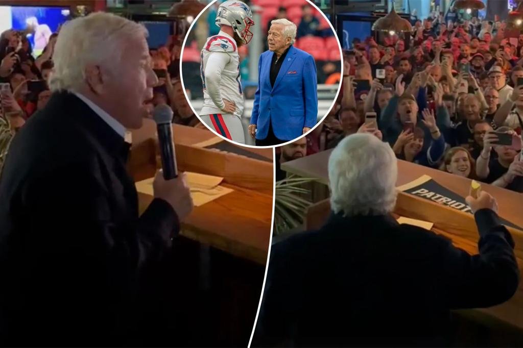 Robert Kraft takes a photo with Patriots fans at a London bar