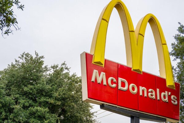 McDonald's is investing $100 million to lure customers back to the fast food giant after an E. coli outbreak