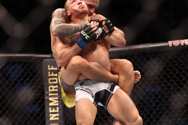 Tom Aspinall overshadows Michael Chandler